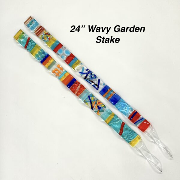 Vibrant glass garden stake with intricate designs, showcasing a burst of colors and artistic patterns