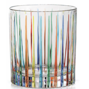 Clear glass tumbler with a heavy base, decorated with thin vertical stripes in red, orange, yellow, green, turquoise and blue rising from the bottom toward the rim.