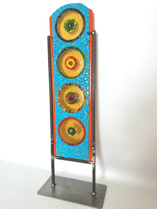 Vibrant metal sculpture featuring four plates, colorful and modern design, artistic masterpiece