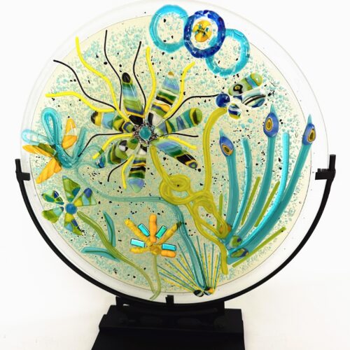 A colorful design featuring Petal Power displayed on a glass plate