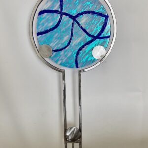 Stunning blue and silver glass art piece on metal stand