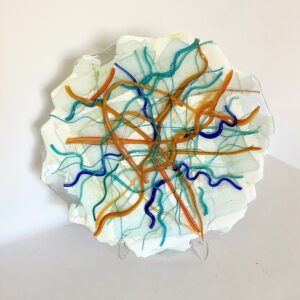 Vibrant orange and blue lines on a glass plate