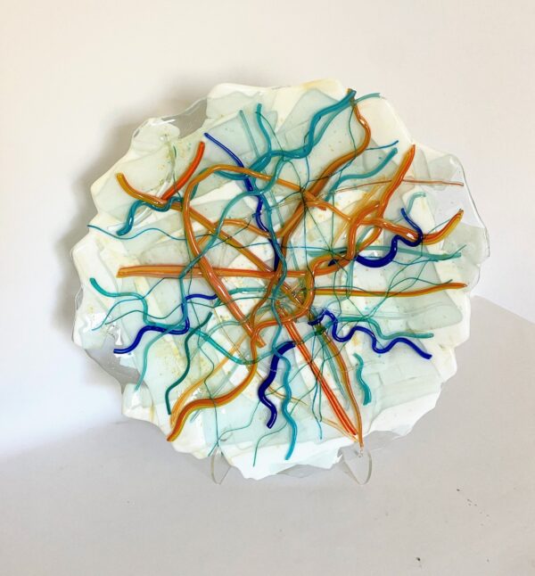Vibrant orange and blue lines on a glass plate